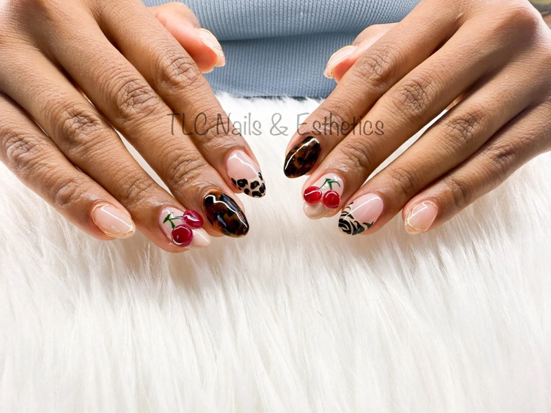 Almond nails with tortoiseshell and cherry nail art by TLC Nails and Esthetics in Nottingham, MD